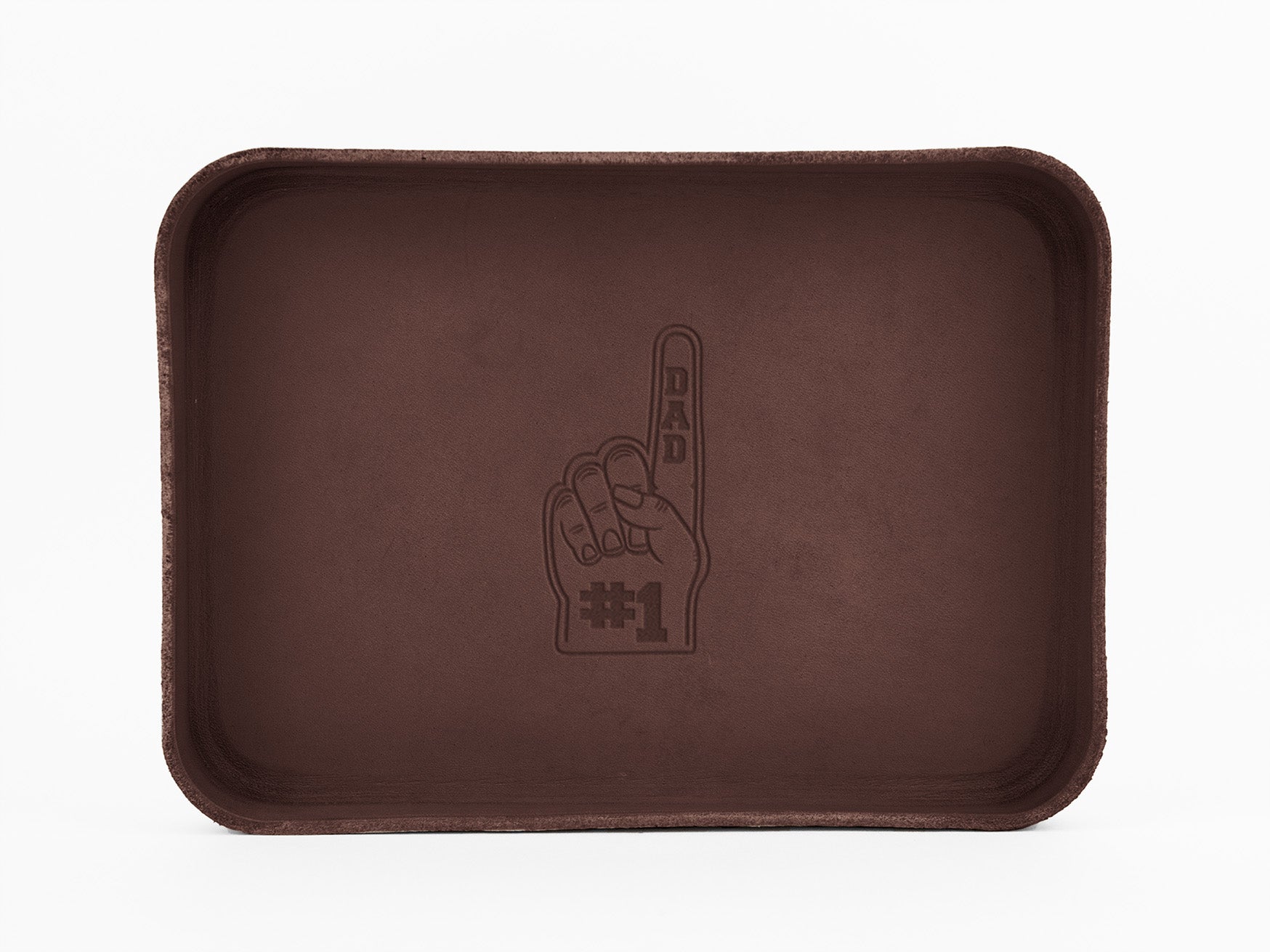 A rectangular brown tray with an engraved graphic of a raised hand showing the index finger, reading “DAD #1” on the palm and finger. The background is plain white.