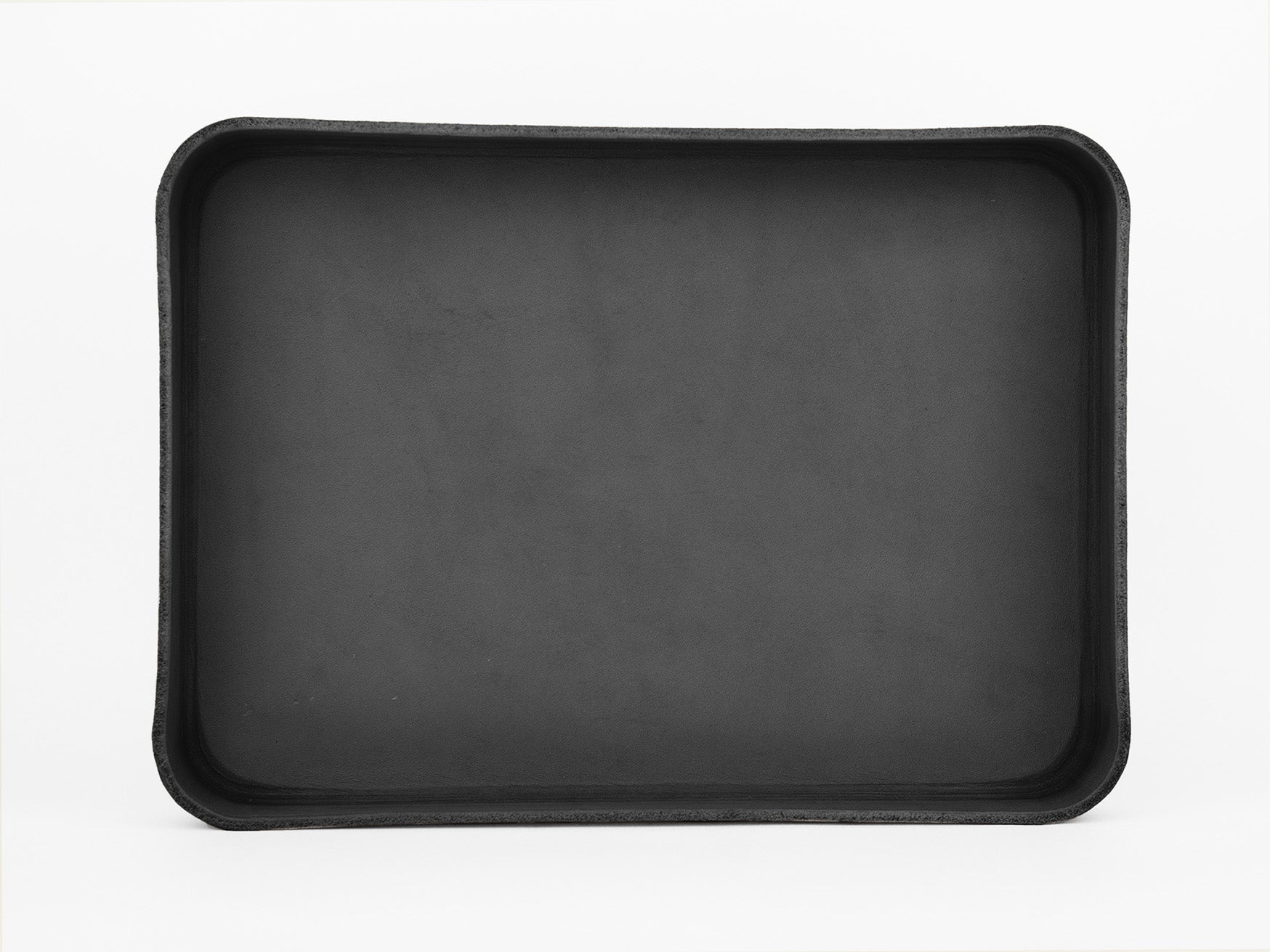 A large, rectangular, black tray with raised edges, photographed against a plain white background. The tray appears empty and has a simple, minimalist design.