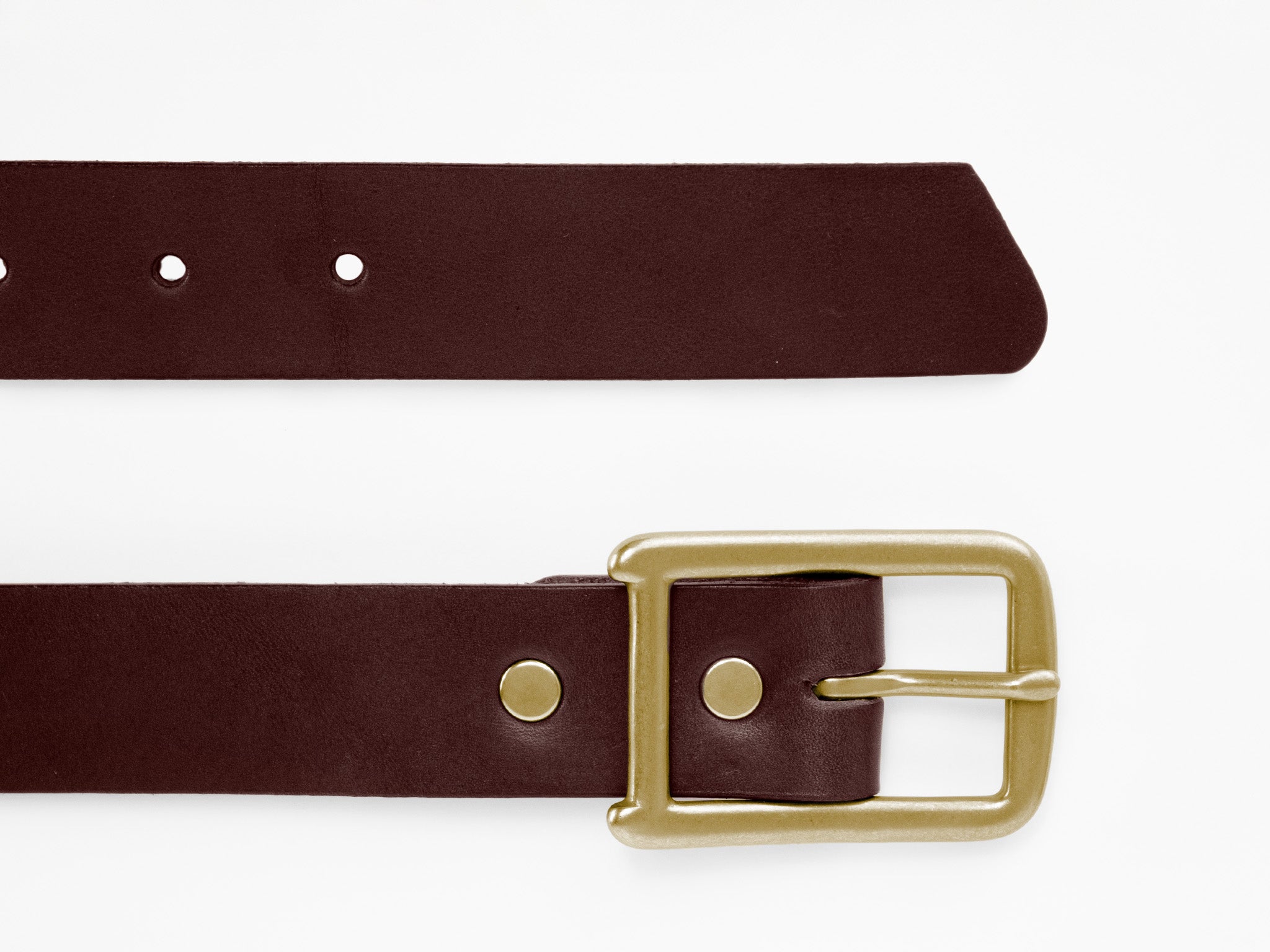 A close-up of a brown leather belt with a gold buckle, shown horizontally against a white background. One end shows the buckle, and the other end displays multiple adjustment holes.