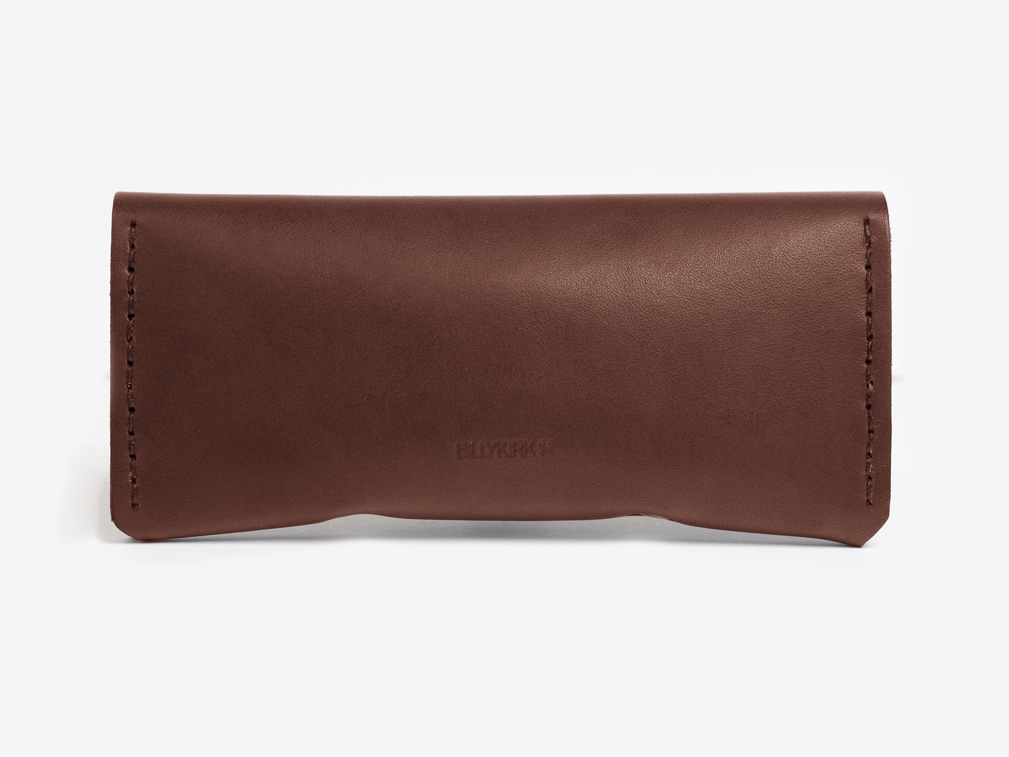A brown leather eyeglass case with visible stitching along the sides, photographed against a plain white background. The case has a simple, rectangular design with rounded corners.