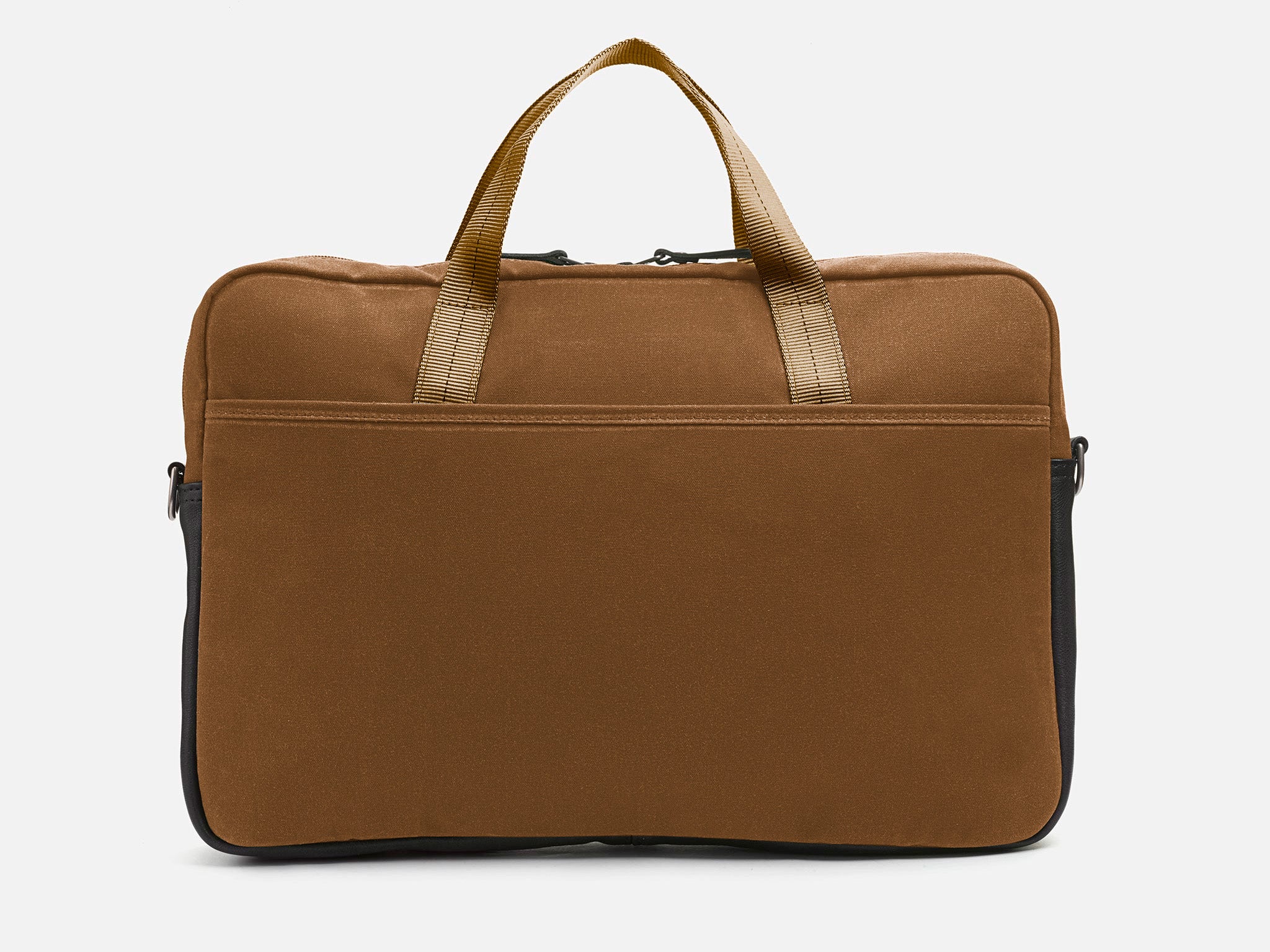 Back view of Brush Brown waxed canvas laptop briefcase bag with tan shoulder straps, a small front pocket, and a black leather bottom detail against a plain background.