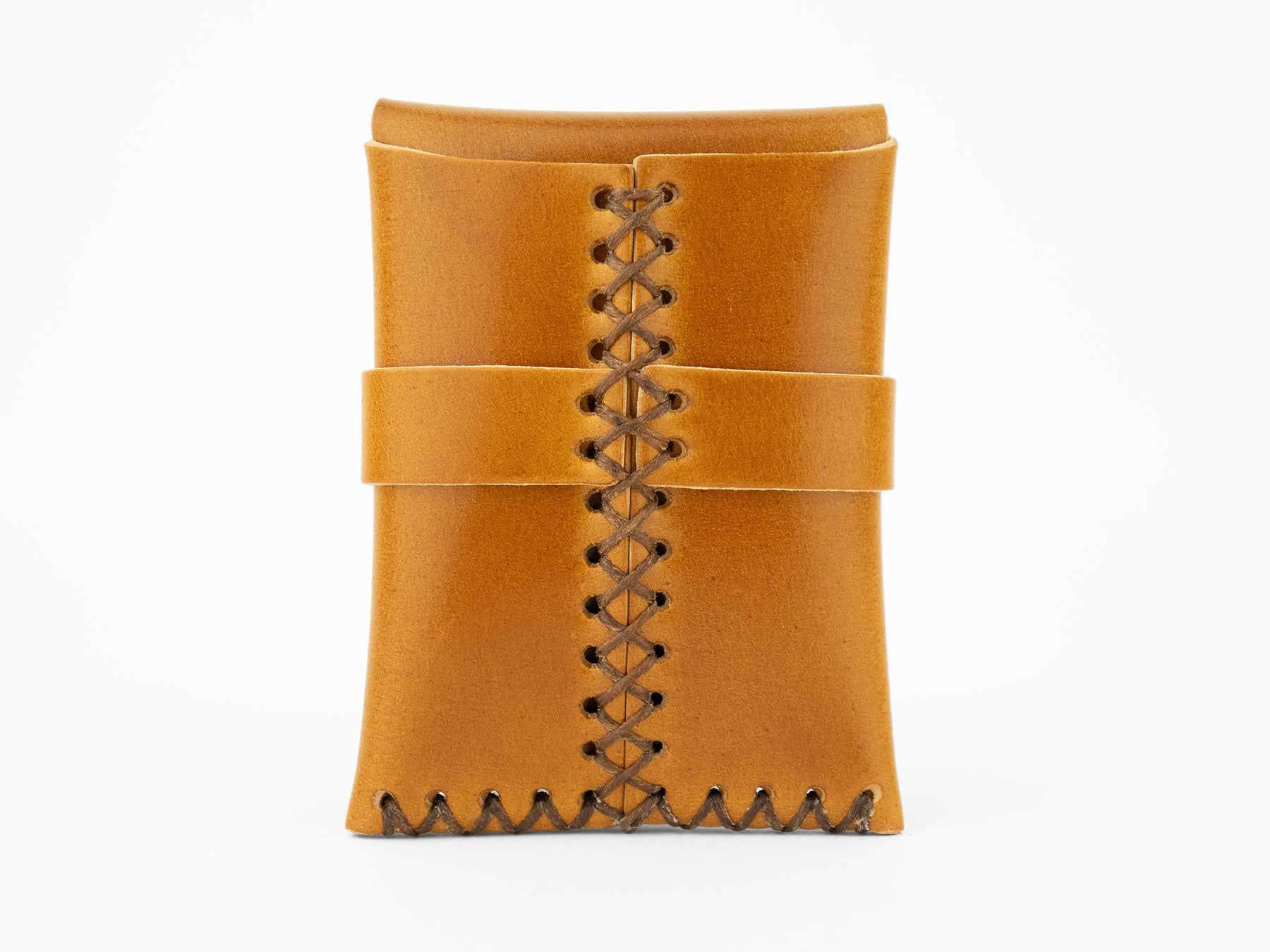 A tan leather pouch with visible brown stitching up the center and along the bottom, featuring a horizontal leather strap around the middle, shown against a plain white background.