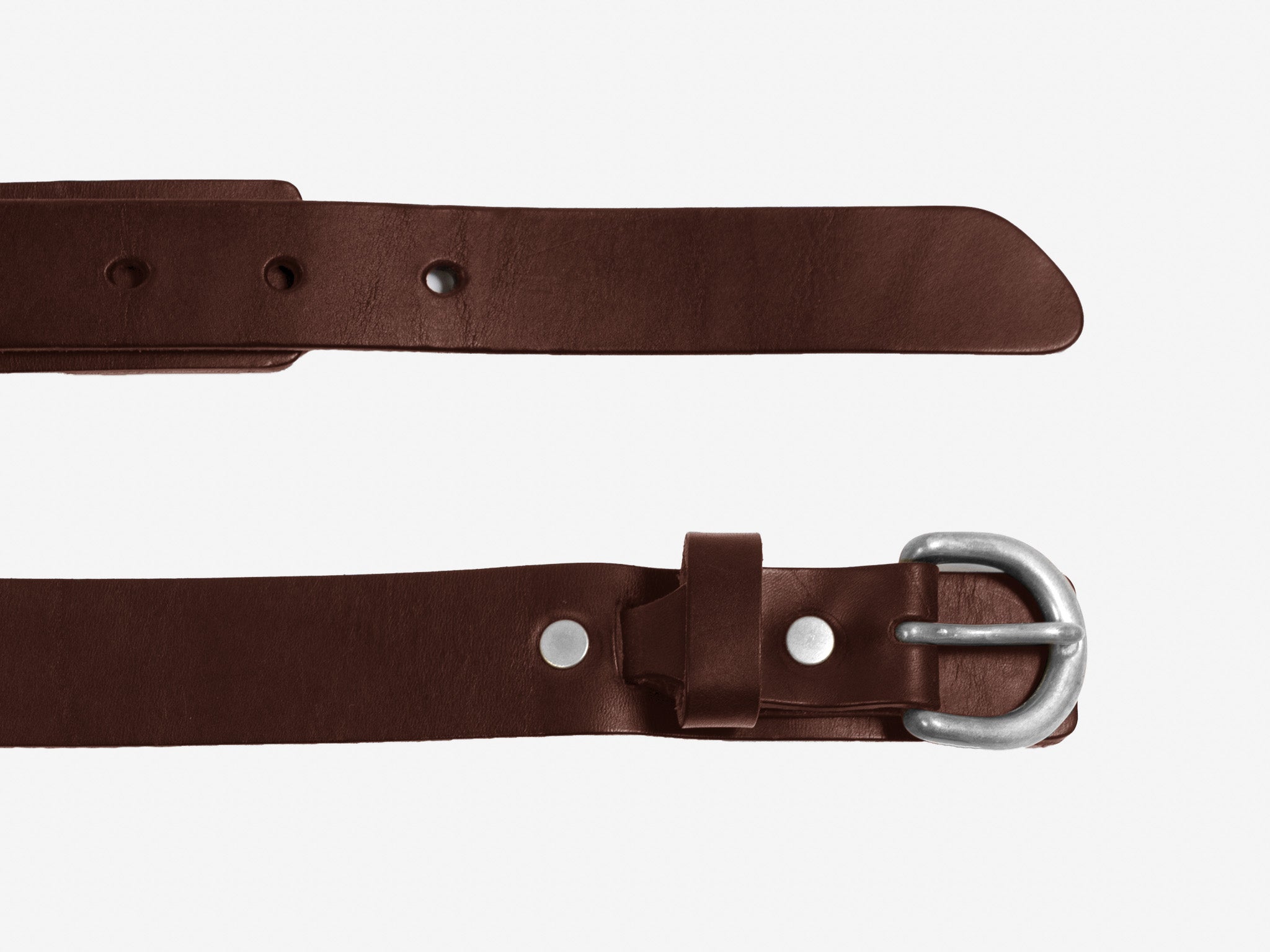 A brown leather belt with a silver buckle, shown laid flat on a white background. The belt features punched holes and a metal rivet near the end.