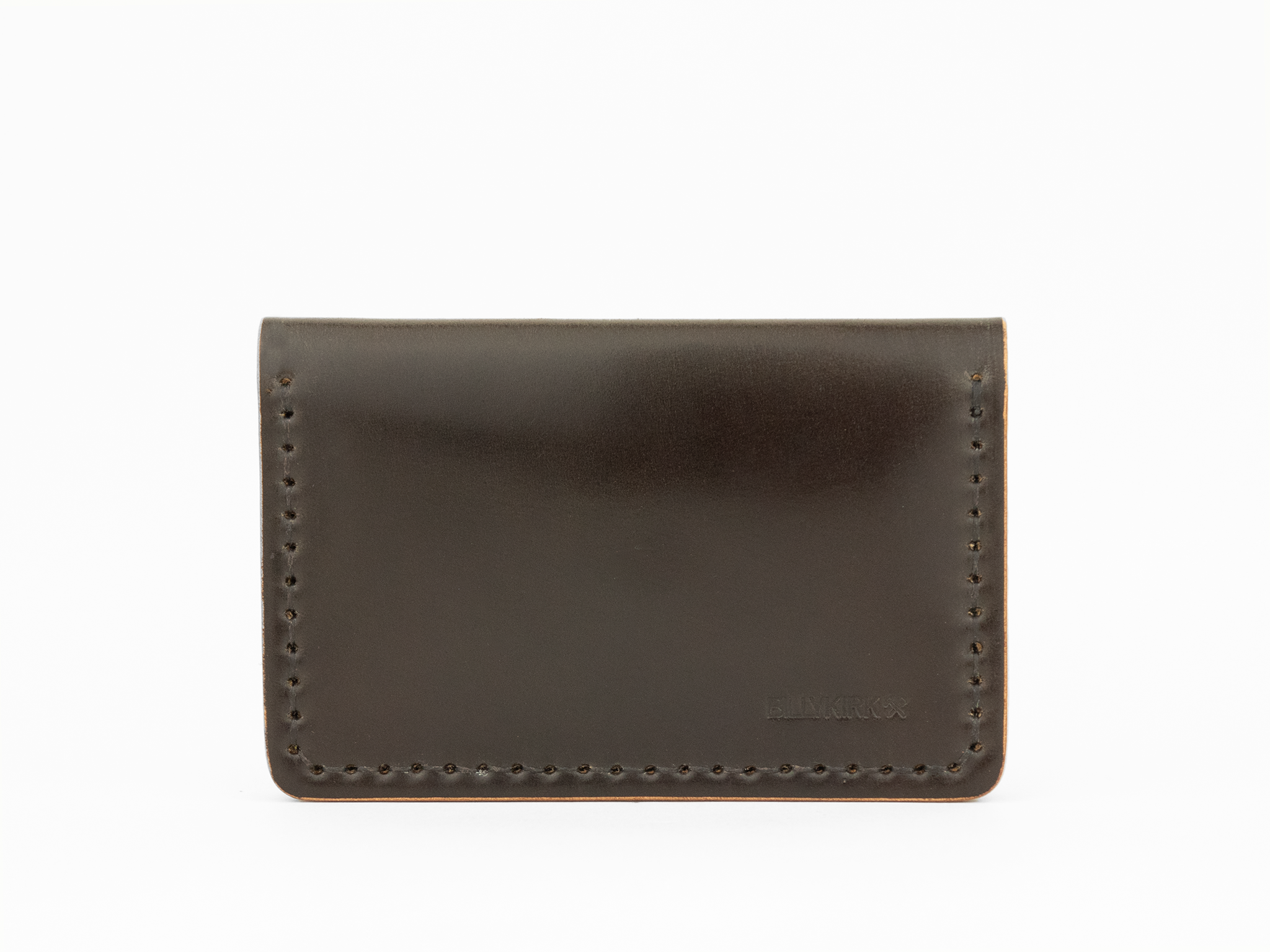 A minimalist, dark brown cordovan leather cardholder wallet with visible stitching around the edges and a subtle embossed BILLYKIRK logo in the lower right corner, set against a white background.