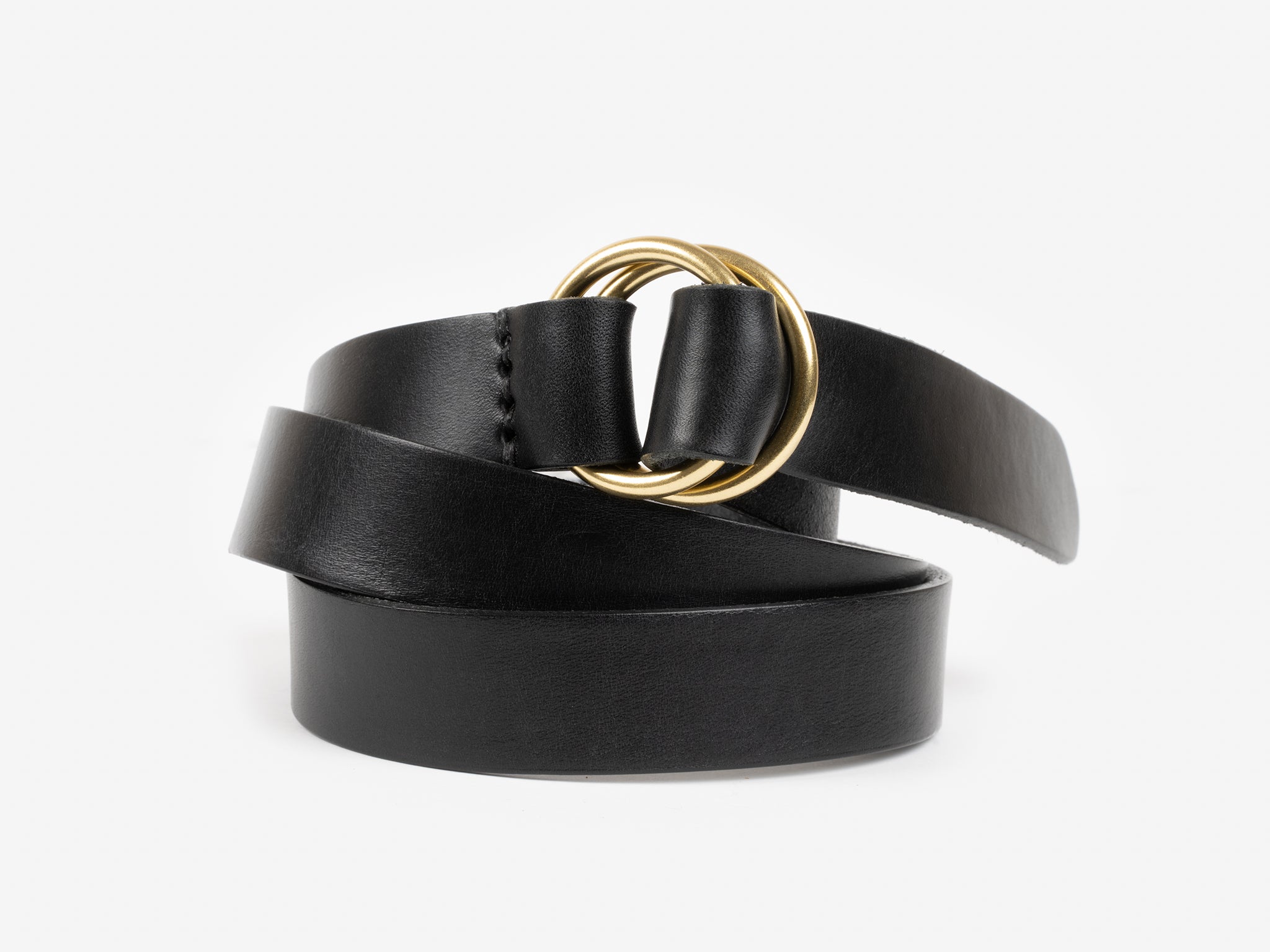 A black leather belt with a double gold circular buckle, coiled neatly on a plain white background.