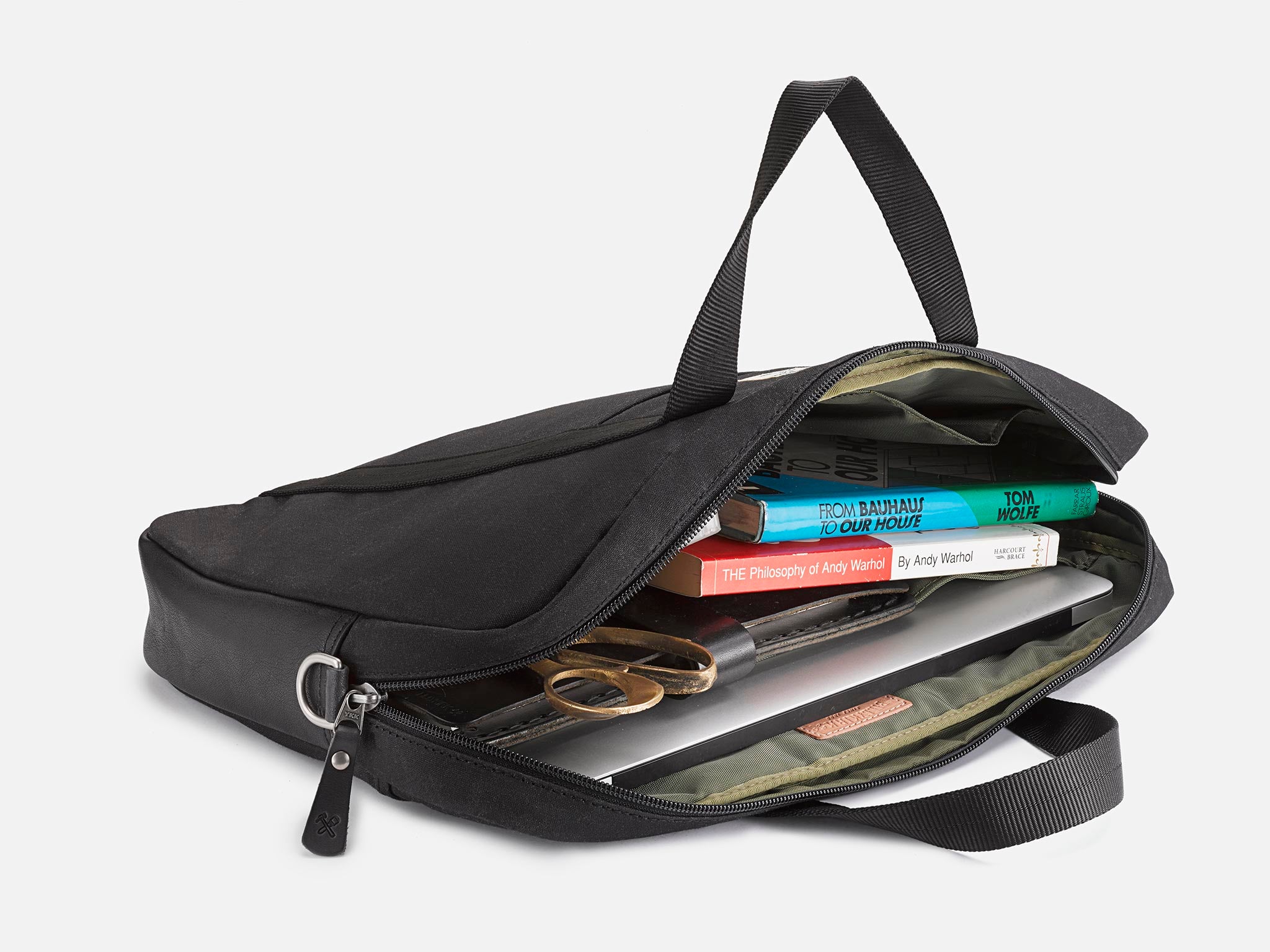 A black laptop bag with two short handles, a front pocket, and a simple, minimalist design, shown against a white background.