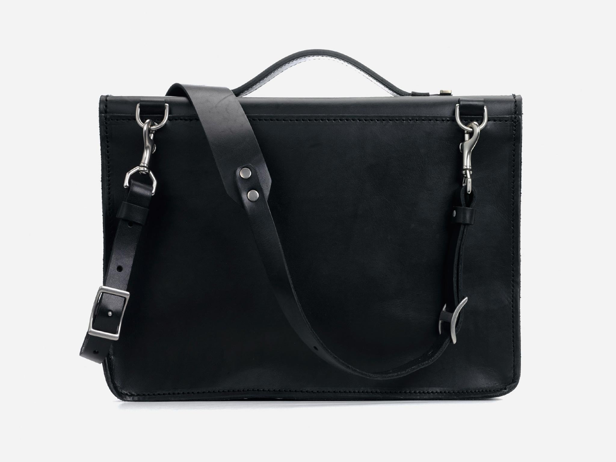 A black leather briefcase with a top handle and an adjustable shoulder strap, featuring silver hardware and a rectangular shape, set against a plain white background.