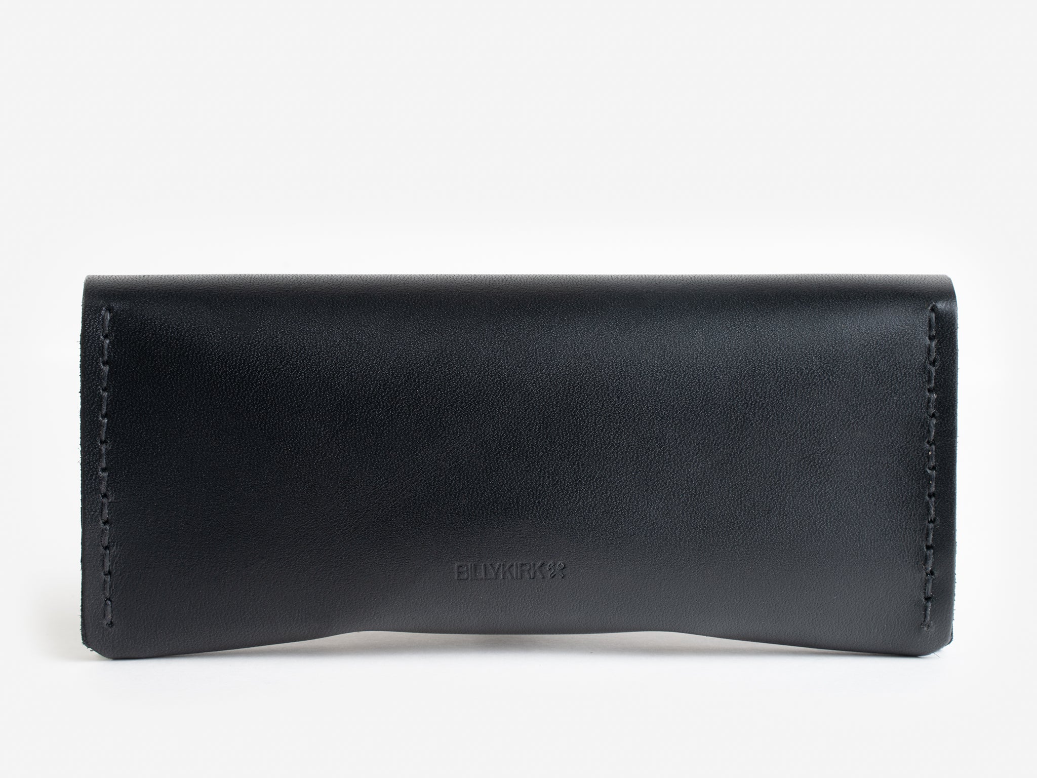 A black leather eyeglasses case with subtle stitching along the sides, displayed against a plain white background. The case has a simple, minimalist design with a slight curve at the bottom edge.