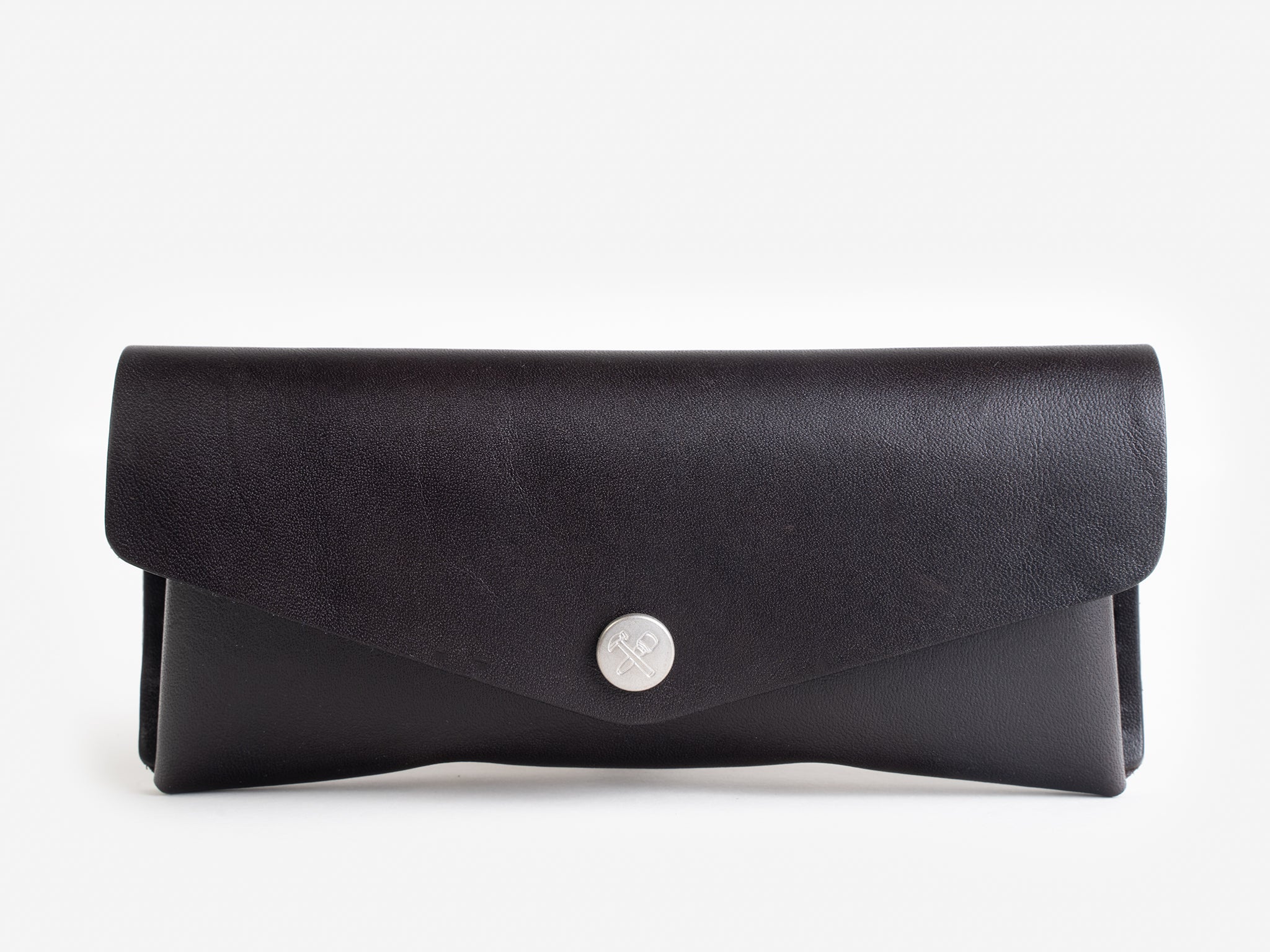 A black leather envelope-style wallet with a silver button clasp, set against a plain white background.