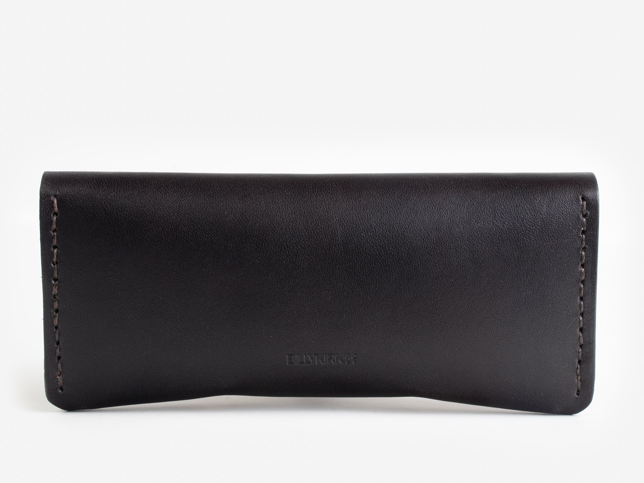 A minimalist, rectangular black leather case with visible stitching along the sides, photographed against a white background.