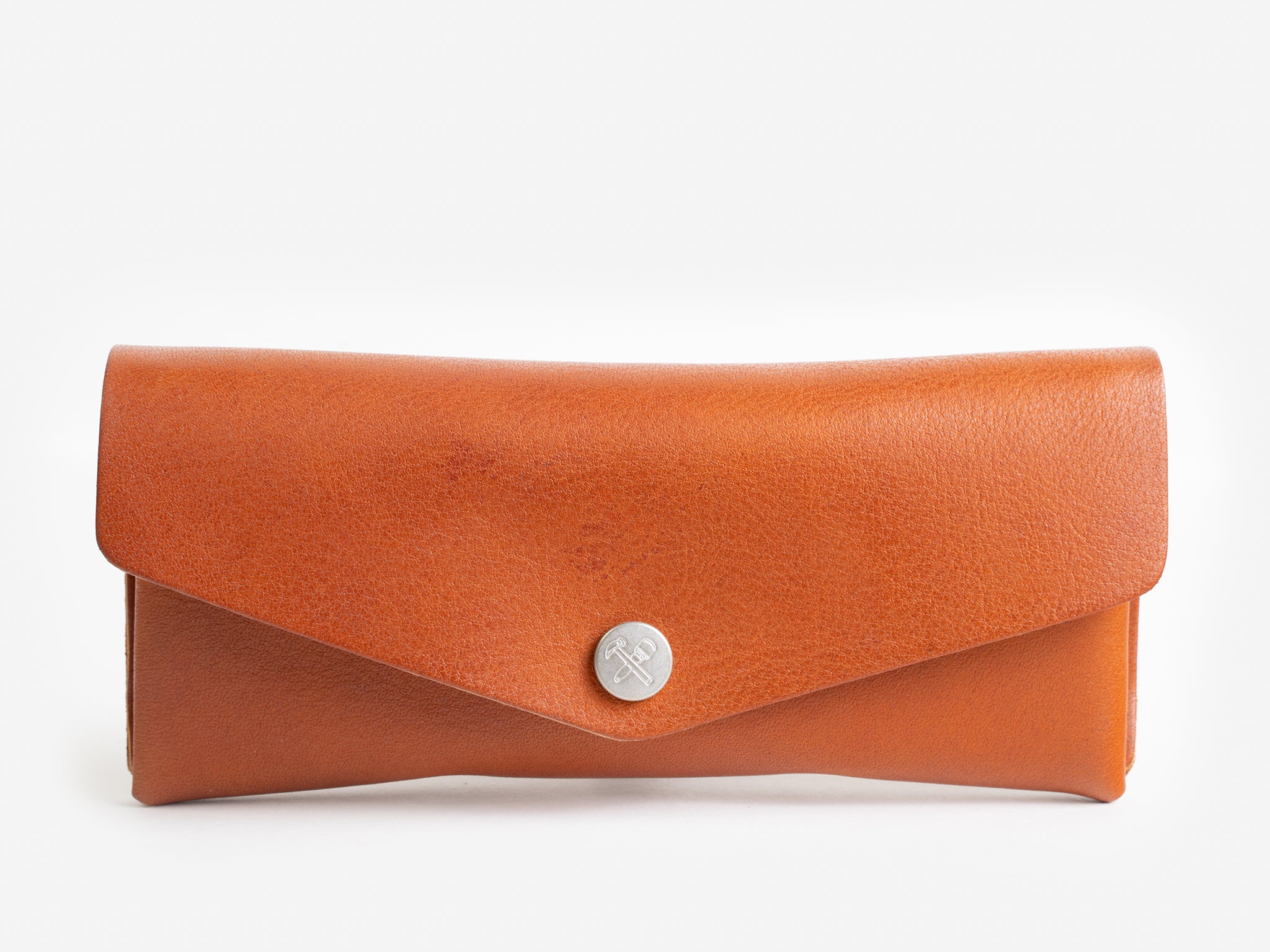 A brown leather eyeglass case with a flap closure and a silver button in the center, displayed against a plain white background.