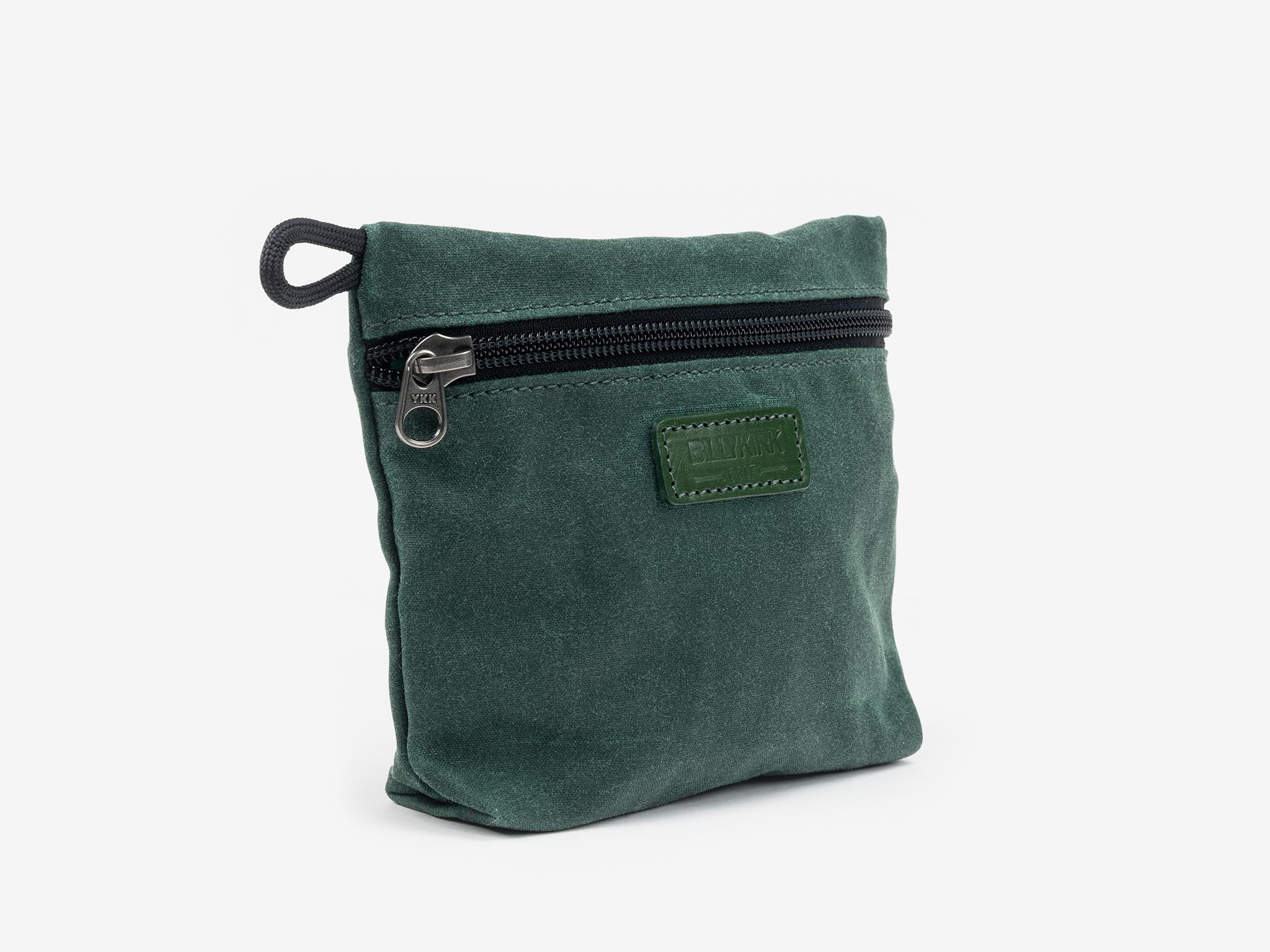 A small, square, dark green fabric pouch with a black zipper and a short black loop on one side, displayed against a plain white background.