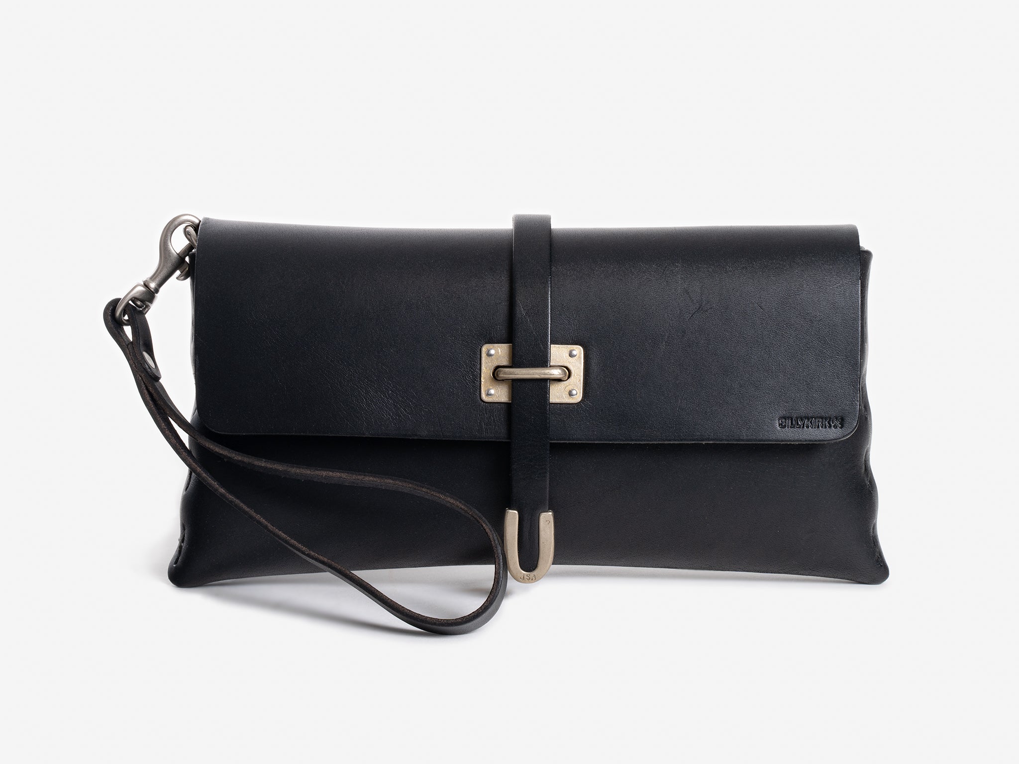 A black leather clutch bag with a metal clasp, strap, and subtle embossed branding on the front, displayed against a plain white background.