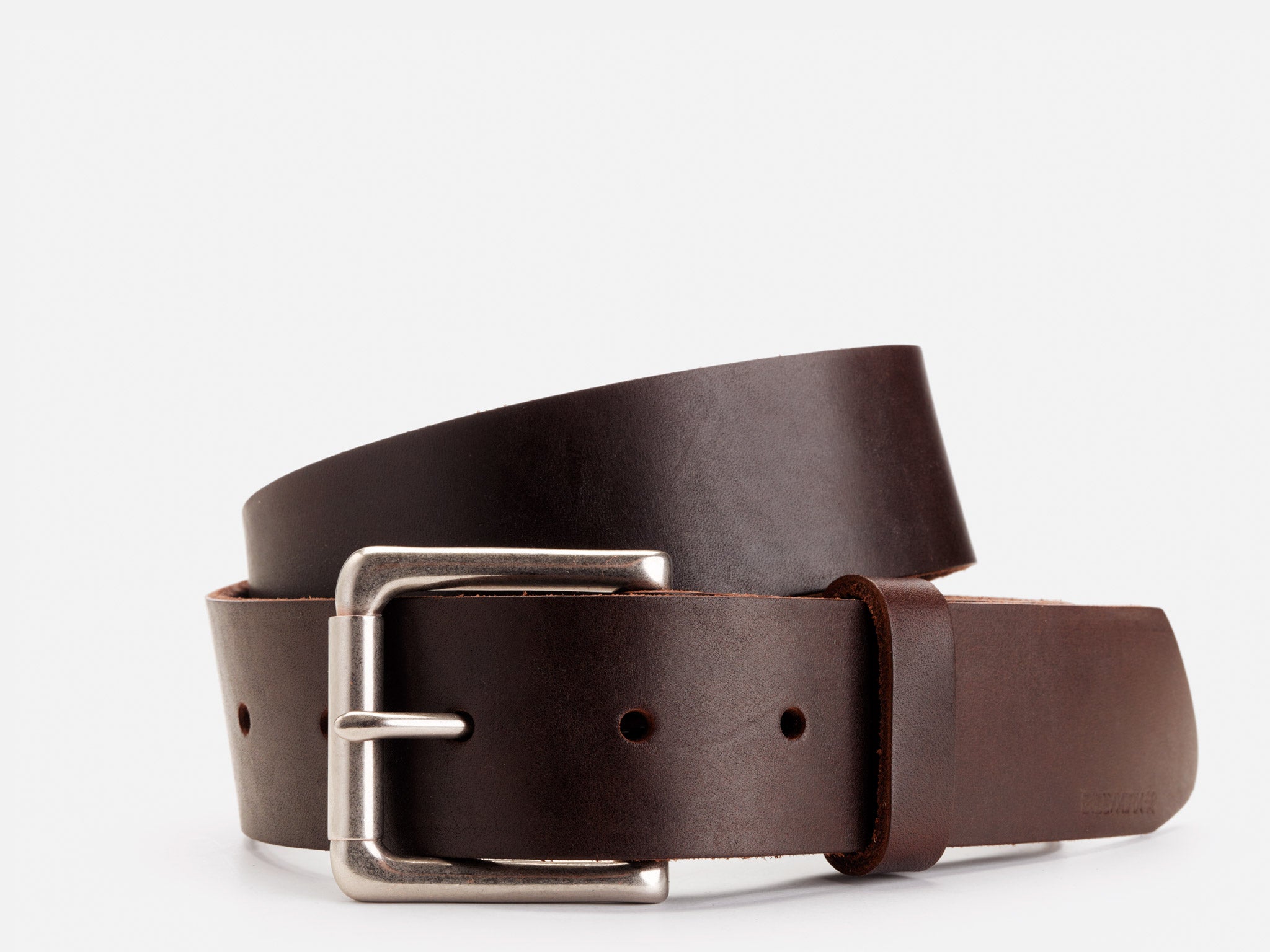 A dark brown leather belt with a silver rectangular buckle, neatly coiled against a plain white background.
